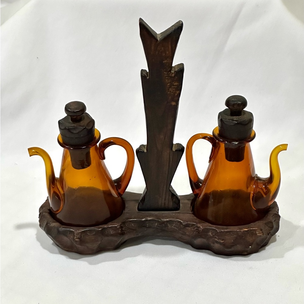 Vintage amber glass oil and vinegar cruets in wood base